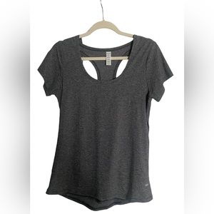 Women’s size small active top. NEVER BEEN WORN. Unique back design.